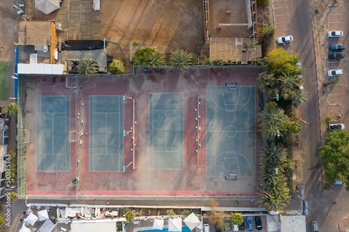 Aerial view of basketball court and tennis courts