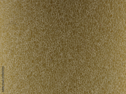 Close-up yellow sponge. Background and textured concept.