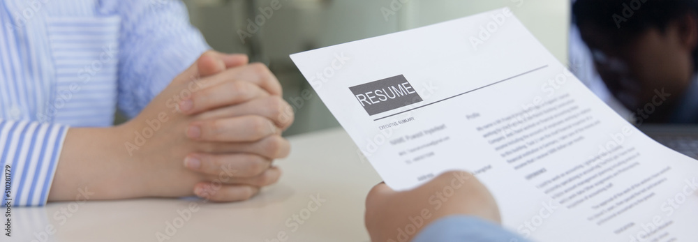 Obraz premium Employer or selection committee is reading the candidate's resume and competence background, Job interview by HR, History exam and work ability, Employment and Recruitment Concept..