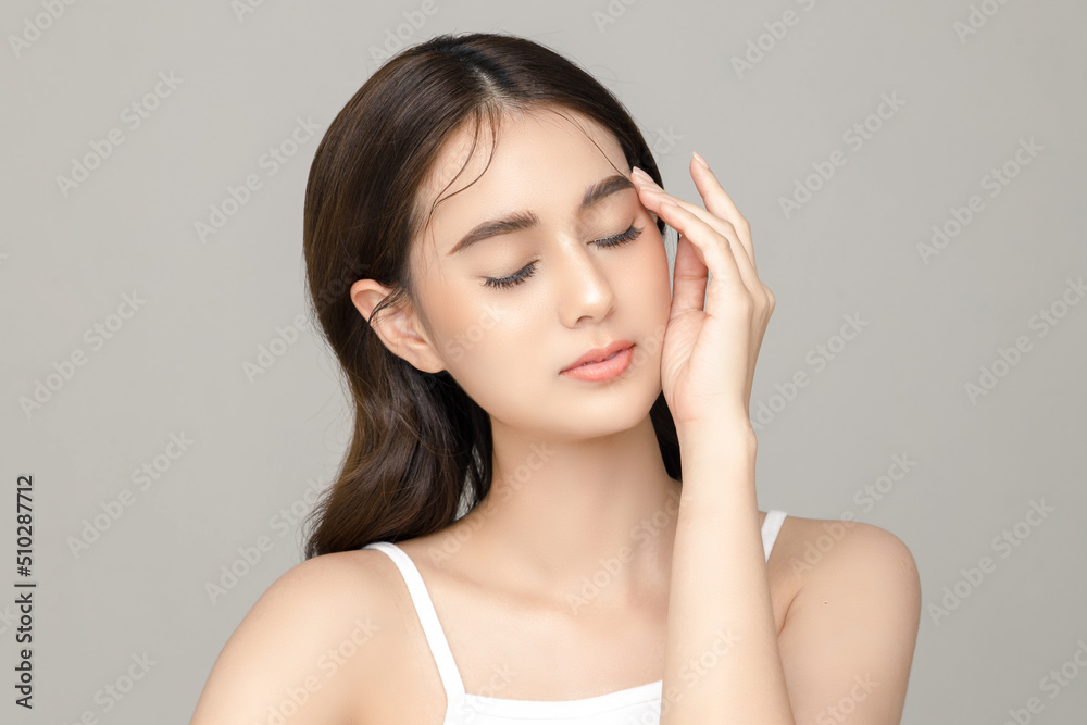 Beautiful young Asian woman model touch her face with perfect clean ...