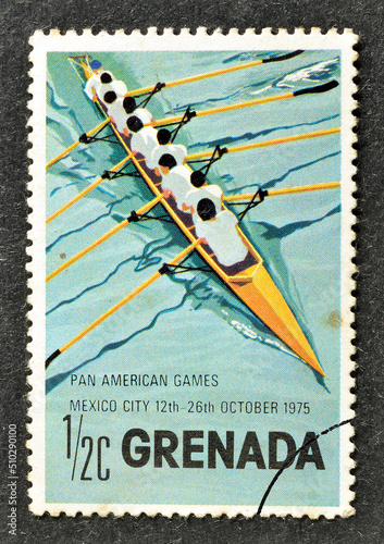 cancelled postage stamp printed by Grenada, that shows Rowing eight, 7th Pan-American Games, circa 1975. photo
