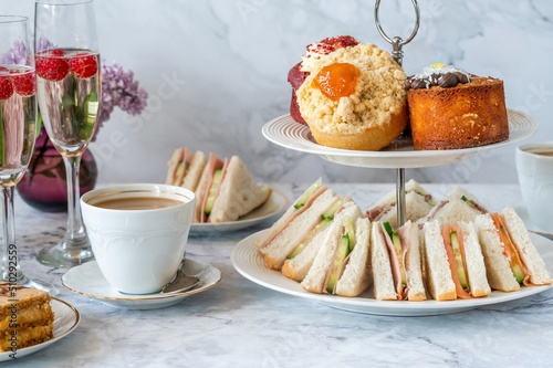 Photos Selection of gourmet cakes and mini canapes with coffee and sparkling wine on a