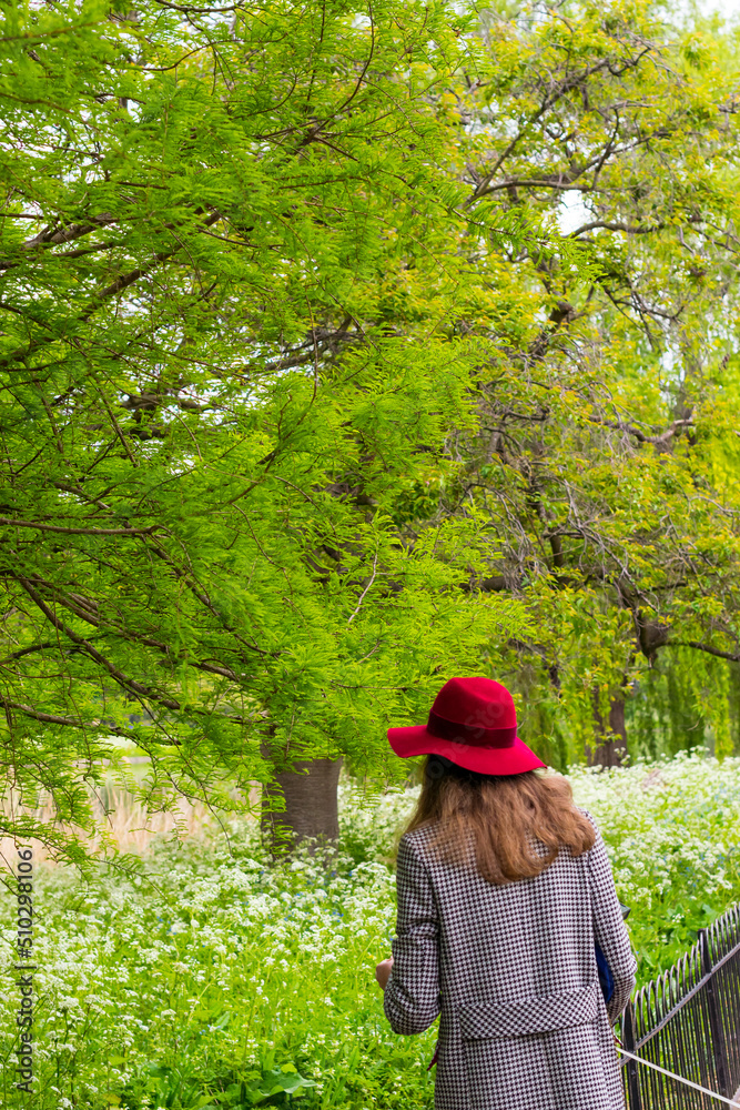Woman in a red hat in the park