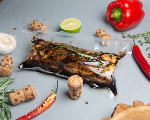 pork rib in a vacuum bag with herbs