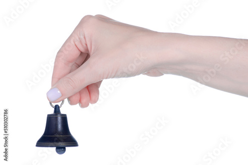 The metal bell in hand on white background isolation