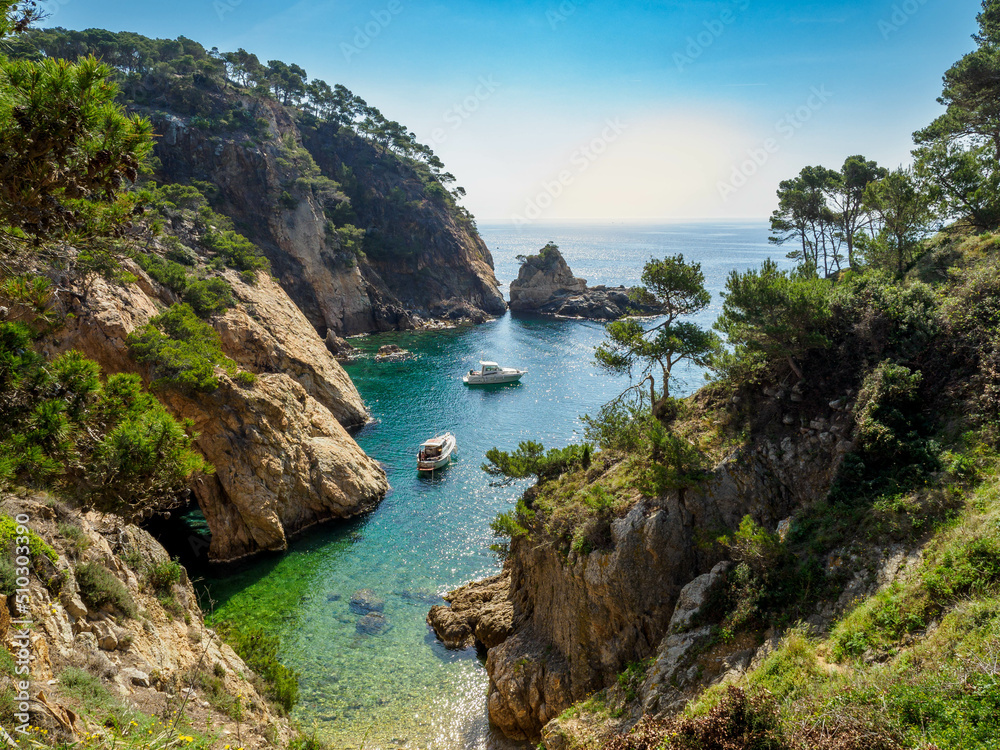 View of secluded cove with emerald green water near Palamos, Catalonia View of secluded cove with emerald green water near Palamos, Catalonia