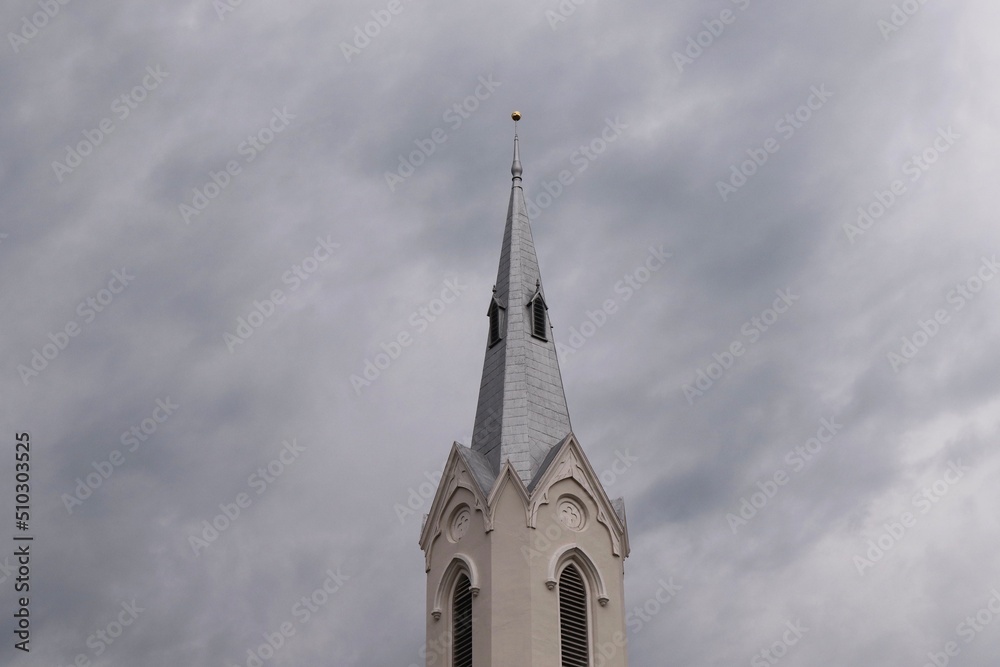 Church Steeple Clouds Grey  Sky and Beige Architecture