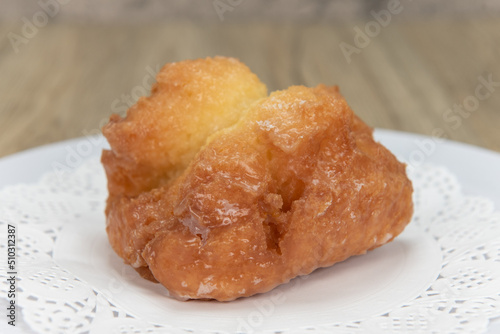 Canvas Print Tempting fresh from the oven buttermilk bar donut from the bakery served on a pl