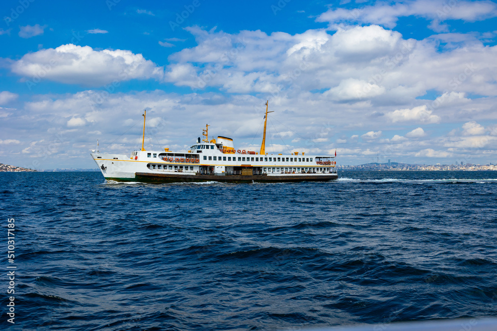Istanbul's famous ferry. Ferry on the Marmara Sea with cloudy sky