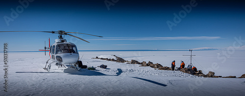 Scientists install experiments in dry valleys, Antarctica, via helicopter