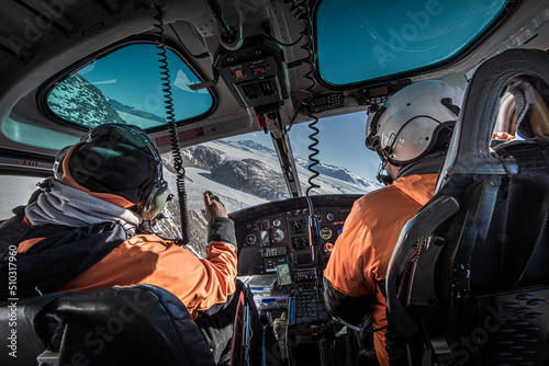 Scientists in helicopter over dry valleys, Antarctica