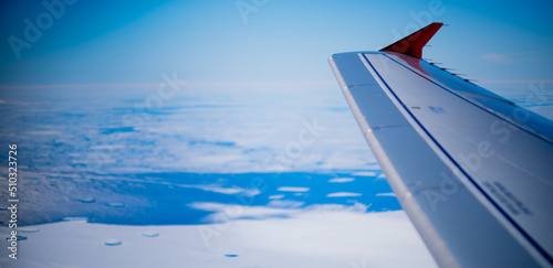 View of aircraft wing flying over Antarctica