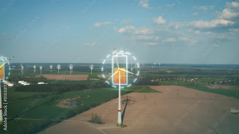 Aerial view of wind farm, rotating propellers producing green energy. Visual effect showing progress of recharging battery Aerial view of wind farm, rotating propellers producing green energy. Visual effect showing progress of recharging battery