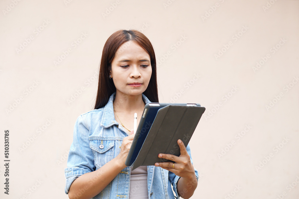 Asian women happily use portable computers. because the operating results are more profitable Asian women happily use portable computers. because the operating results are more profitable