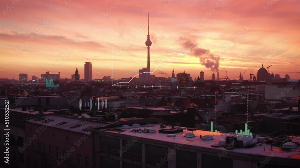 Forwards fly above evening city. Berlin city centre panorama with Fernsehturm. Added computer graphics with charts and financial figures Forwards fly above evening city. Berlin city centre panorama with Fernsehturm. Added computer graphics with charts and financial figures