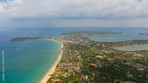 The town of Trincomalee with tourist infrastructure and beaches in Sri Lanka view from above. © Alex Traveler