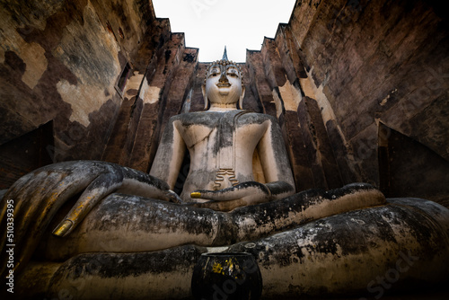 Ancient Architecture and Pra Ajana Buddha Statues in Sri Chum Temple photo