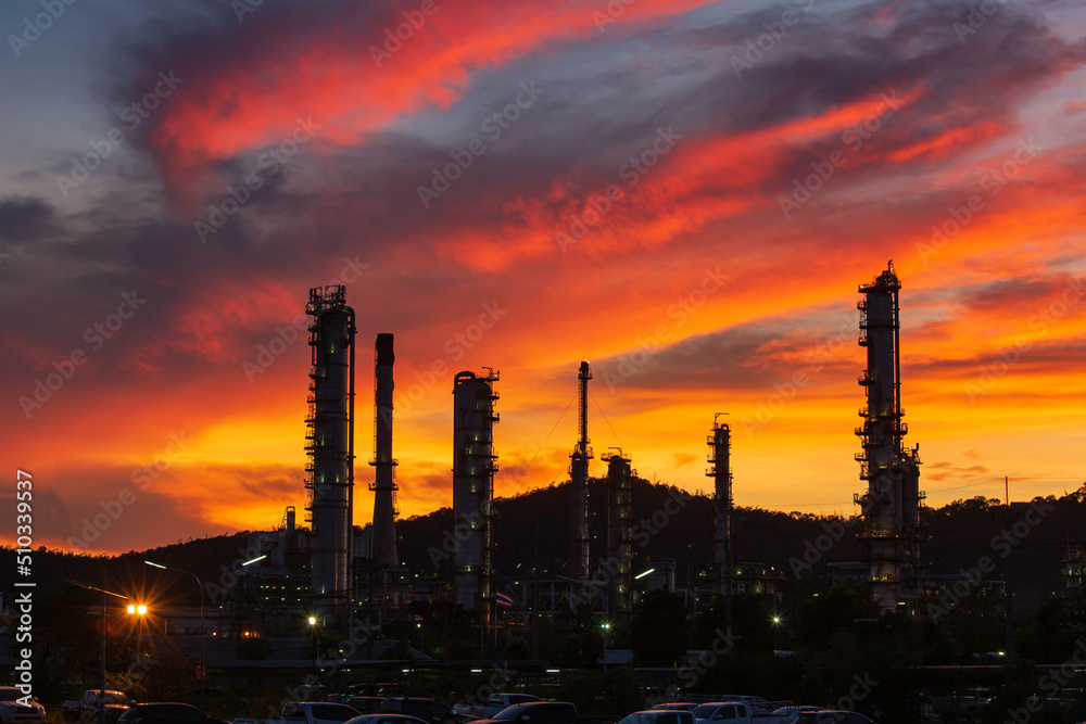 Oil refinery and plant and tower column of Petrochemistry industry in oil and gas industrial with cloud red sky the evening sunset Oil refinery and plant and tower column of Petrochemistry industry in oil and gas industrial with cloud red sky the evening sunset
