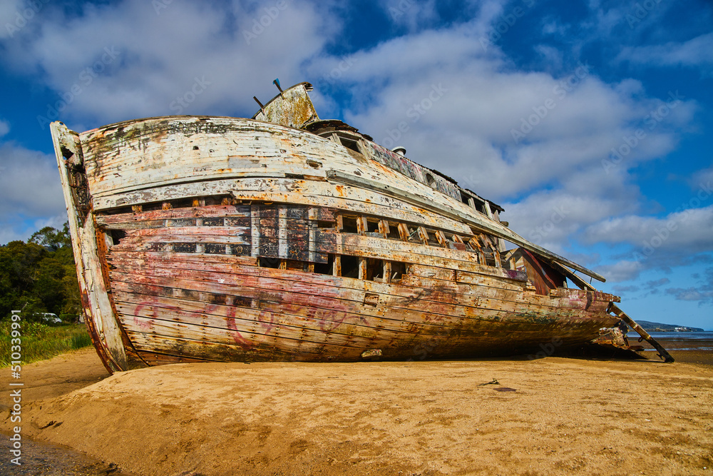Shipwreck falling apart on sandy beaches on west coast