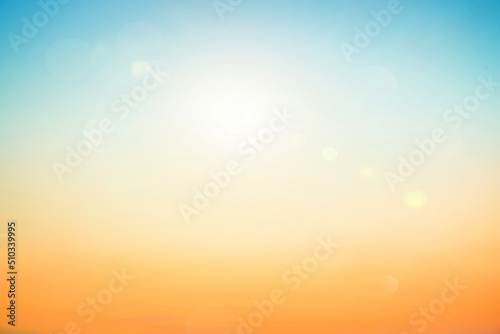 Abstract blurred sunlight beach colorful blurred bokeh background with retro effect autumn sunset sky have blue bright, white, and color orange calm.