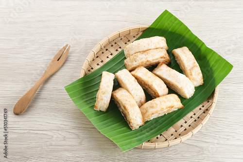 Kue Pancong, Gandos or Bandros is an Indonesian traditional snack made from a mixture of rice flour, grated coconut, and coconut milk.
 photo