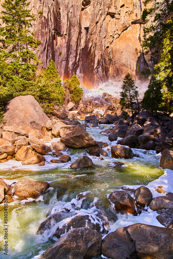 Rainbow over frosty aqua river in early spring at Yosemite Rainbow over frosty aqua river in early spring at Yosemite