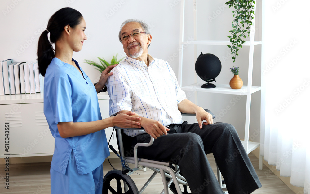 Asia woman nurse helping patient physical therapy at home.