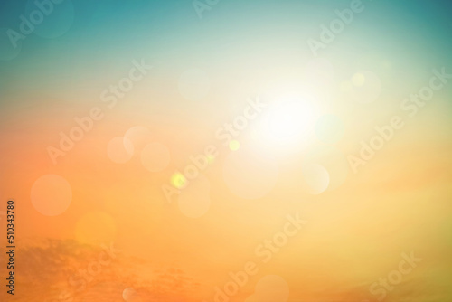 Abstract blurred sunlight beach colorful blurred bokeh background with retro effect autumn sunset sky have blue bright, white, and color orange calm.