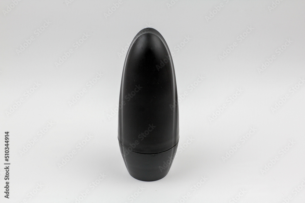 black bottles antiperspirant deodorant on white background. Sweat protection product concept. Flat lay black bottles antiperspirant deodorant on white background. Sweat protection product concept. Flat lay