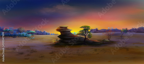 Lone rock in african landscape at sunset