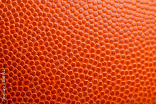 Orange basketball texture pattern close up