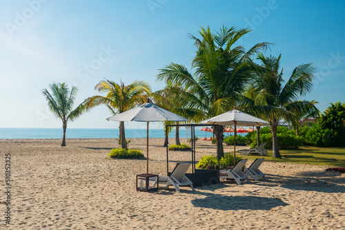 deck chairs with parasol on Cha Am beach at summer  Thailand