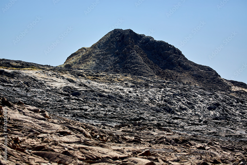 Basaltic lava flow from Erta Ale Lava Lake and the summit of Mount Erta Ale