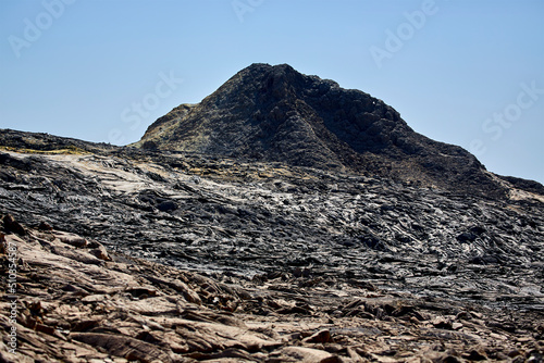 Basaltic lava flow from Erta Ale Lava Lake and the summit of Mount Erta Ale
