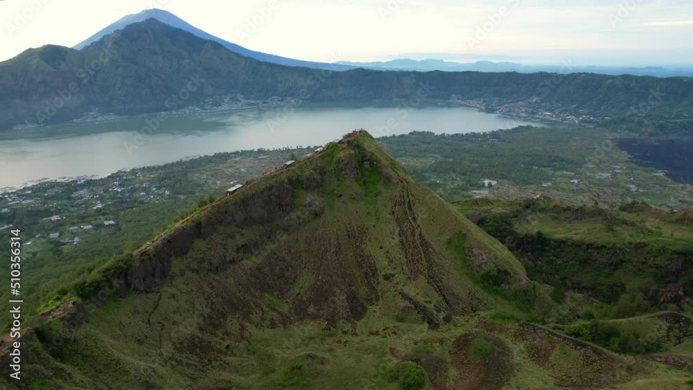 High altitude aerial over Mount Batur crater lake and Mt Agung at sunrise in Bali Indonesia High altitude aerial over Mount Batur crater lake and Mt Agung at sunrise in Bali Indonesia