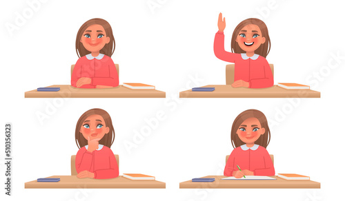 Little girl an elementary school student sits at a table. Schoolgirl writes in a notebook, raises her hand, thinks