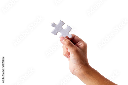 Hand Holding a blank jigsaw piece