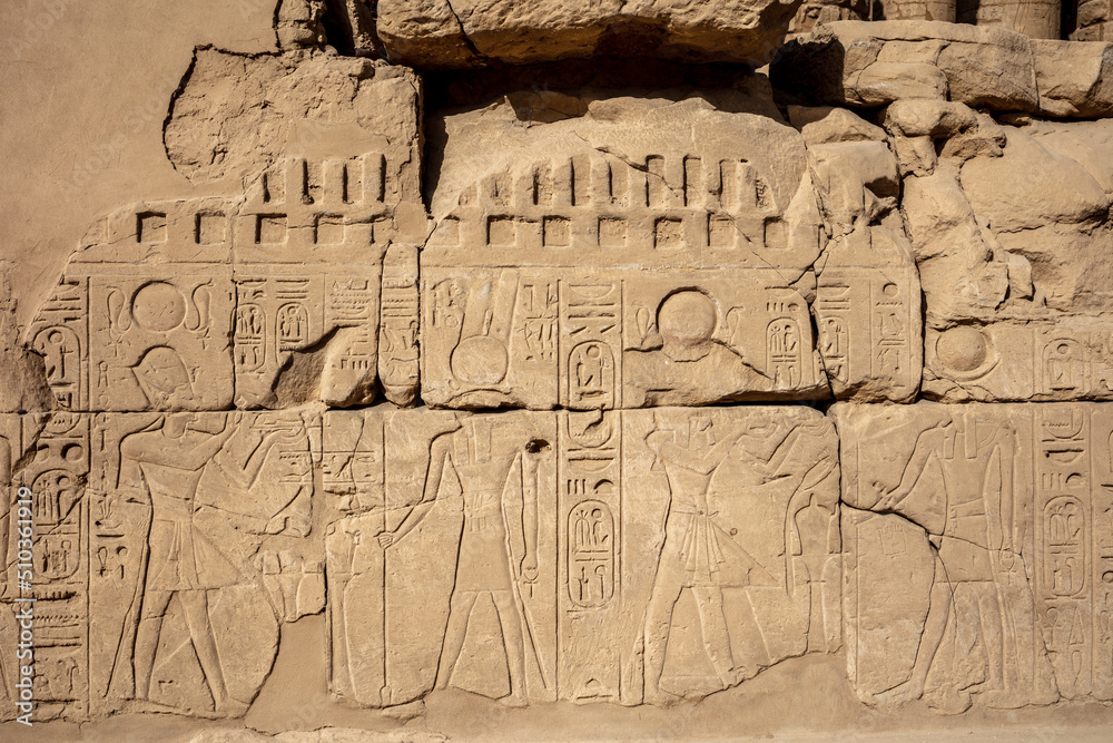 Different hieroglyphs on the walls and columns in the Karnak temple. Karnak temple is the largest complex in ancient Egypt. Different hieroglyphs on the walls and columns in the Karnak temple. Karnak temple is the largest complex in ancient Egypt.