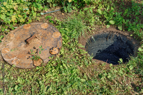 sewer cesspool in a private house, open lid for revision