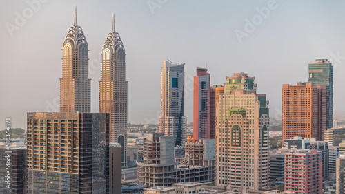 Skyscrapers in Barsha Heights district and internet city towers aerial timelapse. Dubai skyline