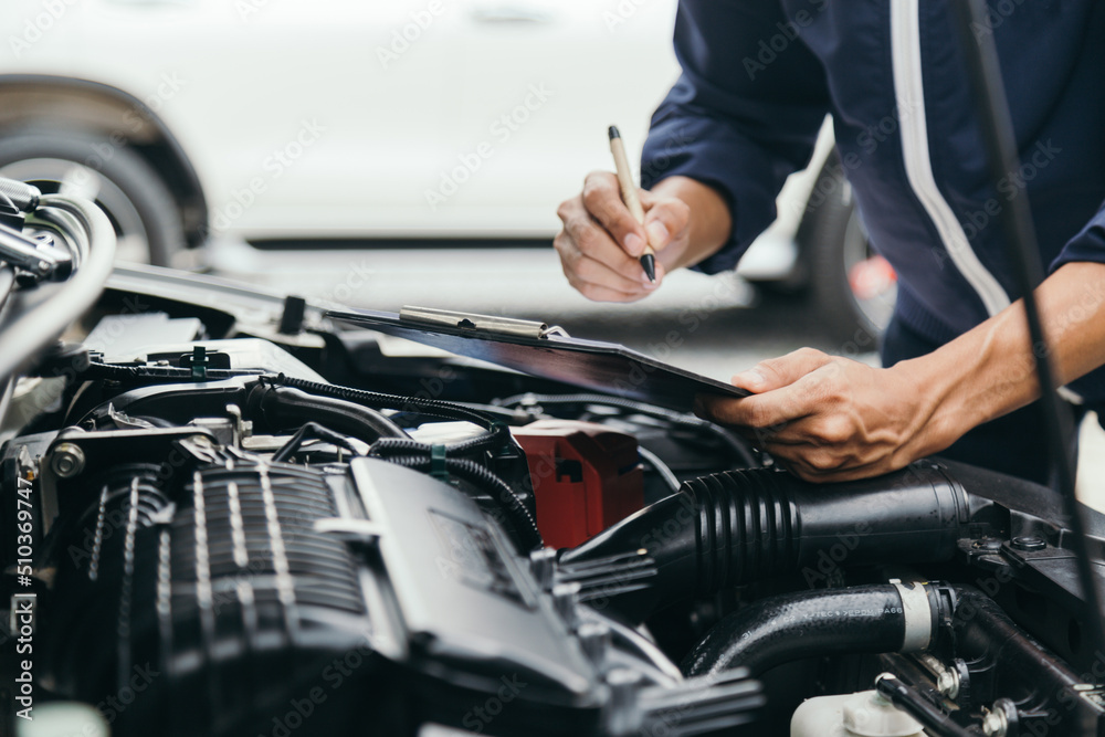 Automobile mechanic repairman hands repairing a car engine automotive workshop with a wrench, car service and maintenance,Repair service.