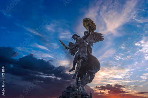 Fotografiet Fountain with a sculpture of Archangel Michael in the park Volodymyr Hill in Kyi