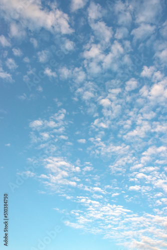 Cover page with soft blue sky with illuminated clouds as a background.