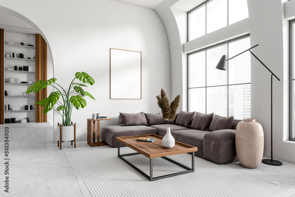 Light living room interior with couch, shelf and panoramic window