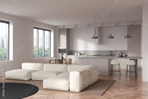 Light kitchen interior with couch and eating area  panoramic window