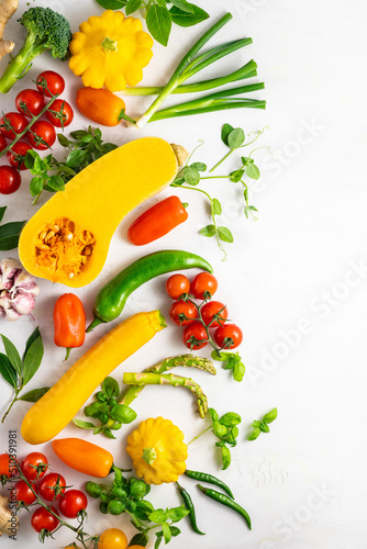 Fototapeta Naklejka Na Ścianę i Meble -  Fresh assorted vegetables and herbs on white background. Healthy clean eating, vegetarian or diet food concept.Food frame.