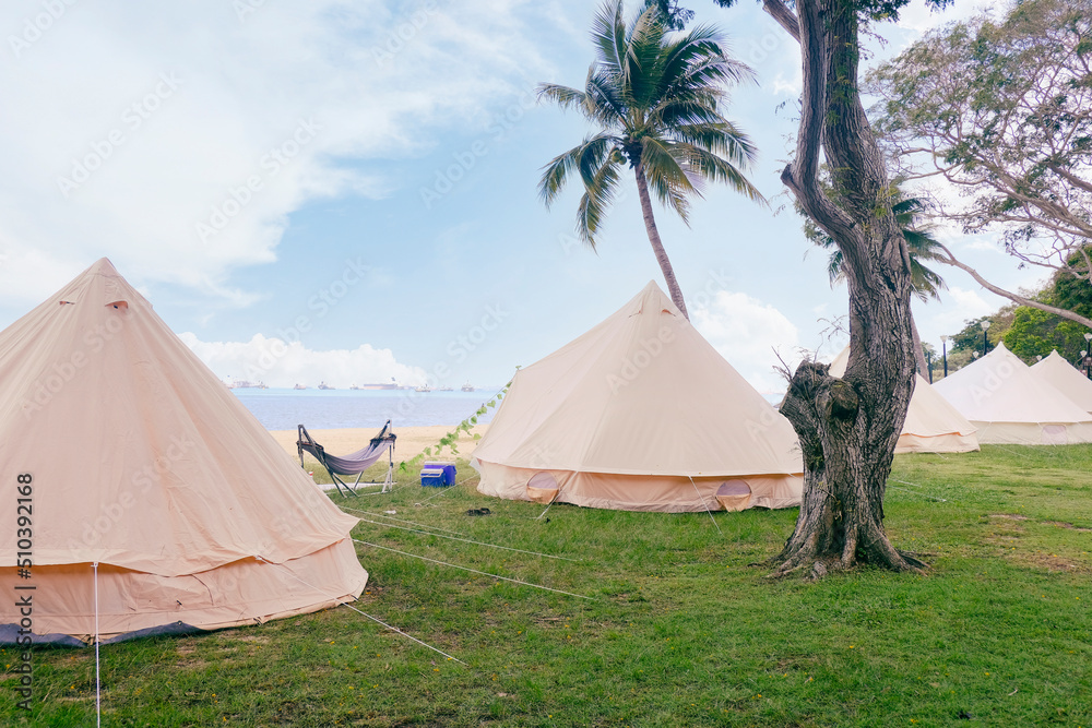 Large family camping tents for rent along East Coast Park in Singapore. Glamping is a popular leisure activity in Singapore, especially for families during the school holidays; staycation fun.