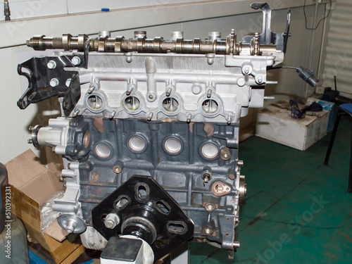 Photography View from the side of the exhaust manifold mounting on a partially disassembled