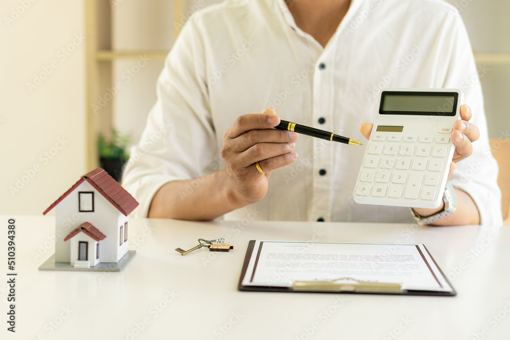 Fototapeta premium Real estate brokers, home sales agents, work on home equity loan documentation to clients and completed home title contracts. at the desk in the office