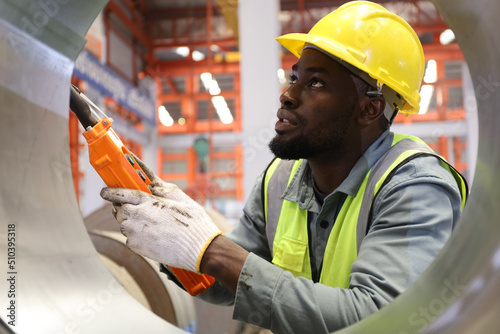 the portrait of worker or technician while working in factory or warehouse industry
